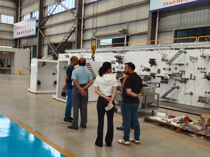 Visitors viewing production machinery in the workshop