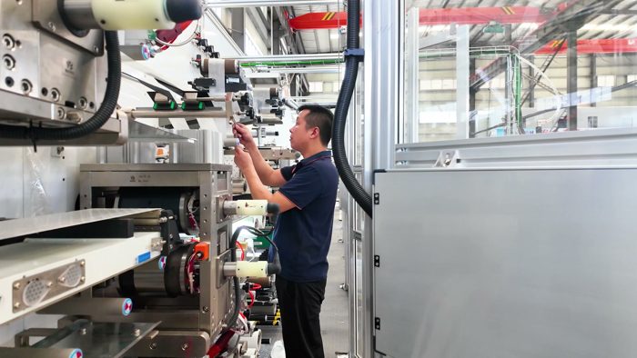 Technician adjusting machinery inside the workshop